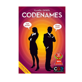Codenames board game box cover by Vlada Chvatal, featuring a magenta and orange gradient background with black silhouettes of a woman and a man, white speech bubbles, and award seals including CCG 2016.